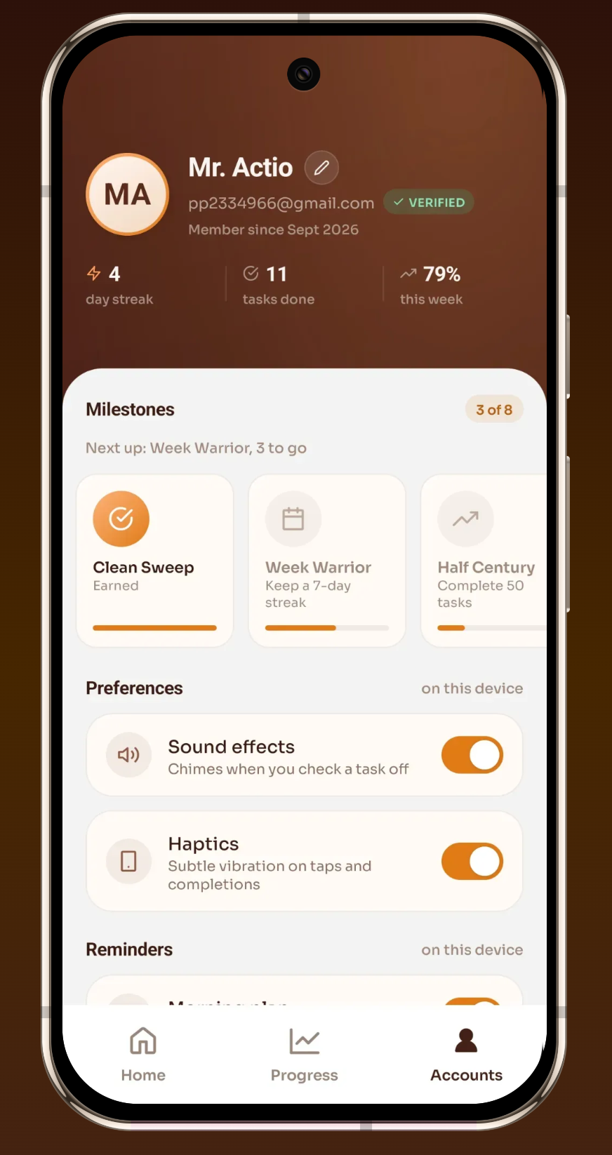 Actio account screen showing earned milestones and sound and haptics preferences